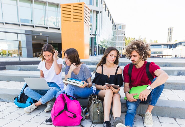 Students sitting on stairs for group discussion