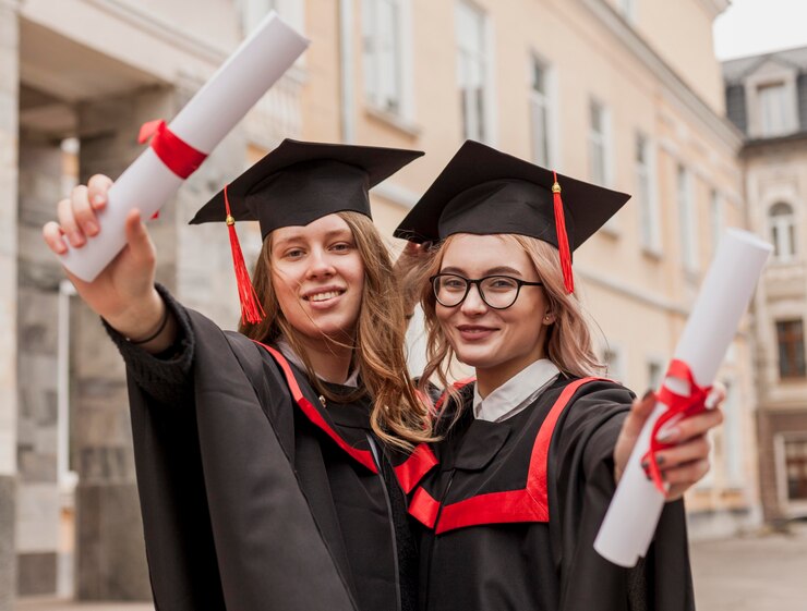 Two scholars showing up their degrees