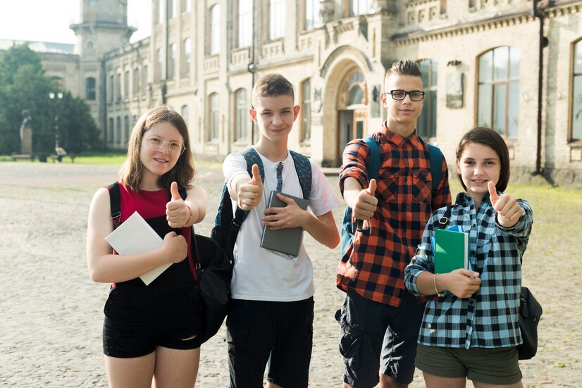 Students showing thumbs up